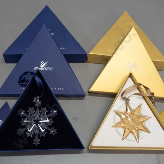 2 Swarovski crystal Christmas snowflake ornaments in original boxes - 2004 and an amber/gold colour 2009