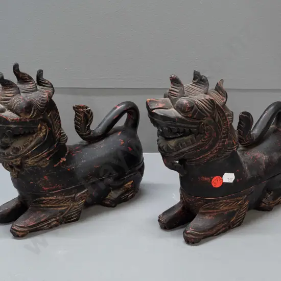 2 Chinese carved wood figural temple lion vessels with lift off tops, some chips and wear to paint over laquer finish
