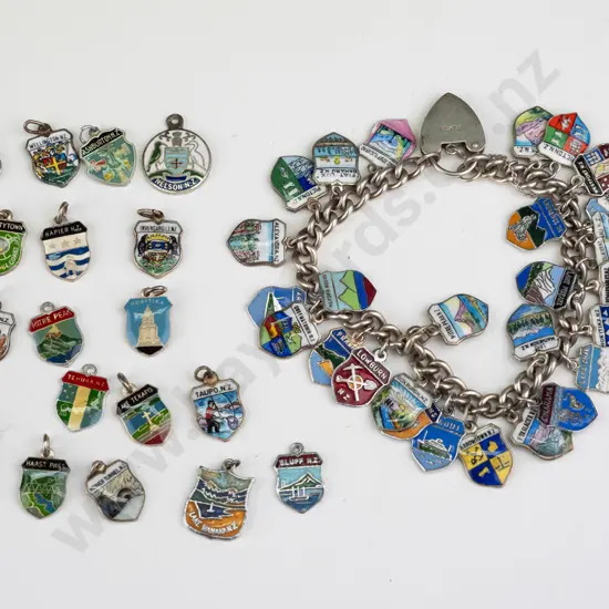 charm bracelet with NZ towns charms & 18 spares charms