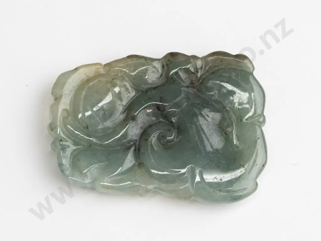 piece of carved greenstone Image 1++