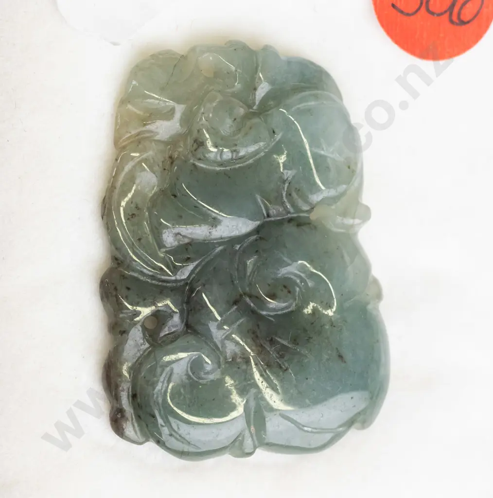 piece of carved greenstone Image 1++