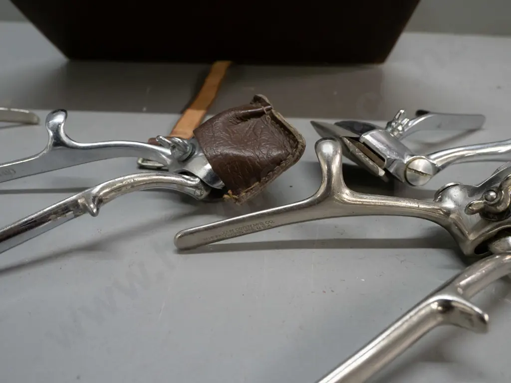 lined leather case with 4 vintage hair clippers, varying makes - 2x Burman England, John Oster Racine USA, one unmarked Image 1++