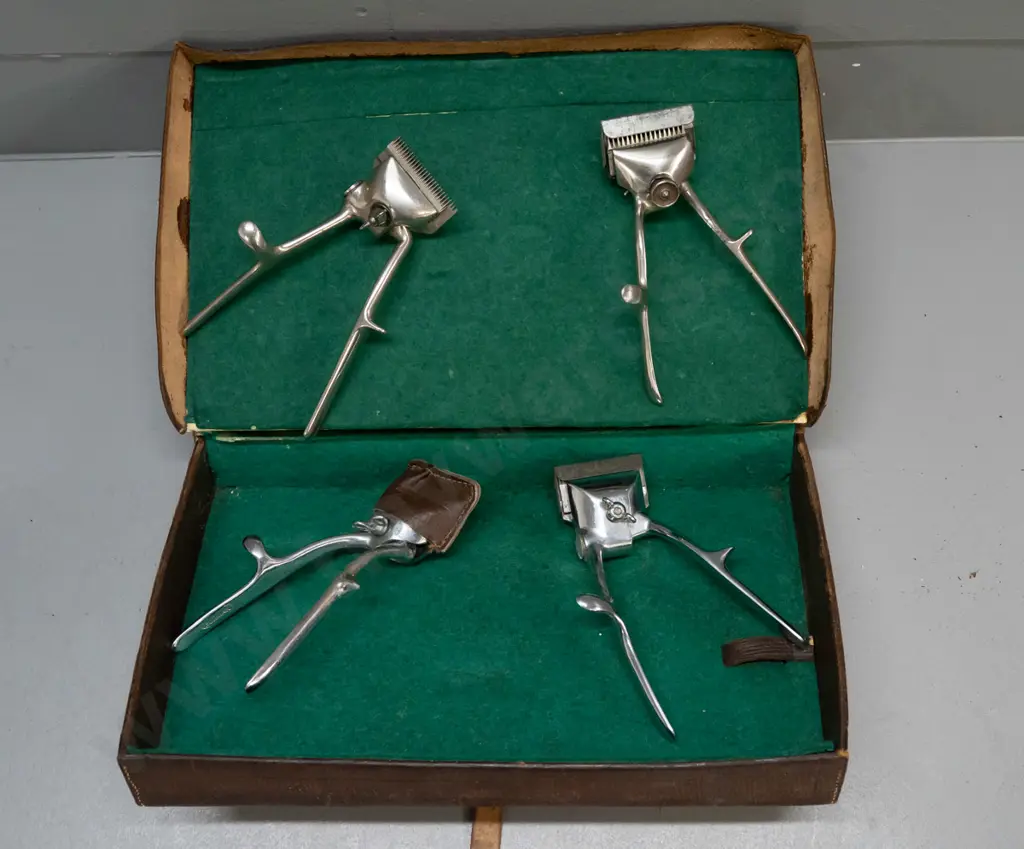 lined leather case with 4 vintage hair clippers, varying makes - 2x Burman England, John Oster Racine USA, one unmarked Image 1++