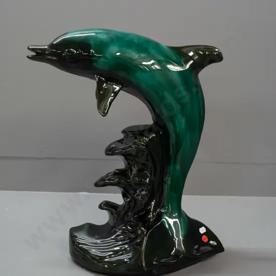 very large Blue Mountain style leaping dolphin on crashing waves figure - scratch on side of dolphin. No maker info.