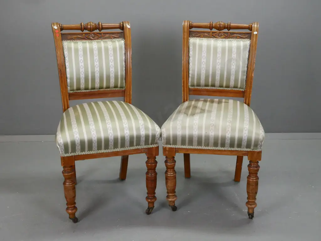 pair of colonial rimu & kauri Cromwellian style chairs with turned top rail and front legs, brown porcelain casters - Image 1++