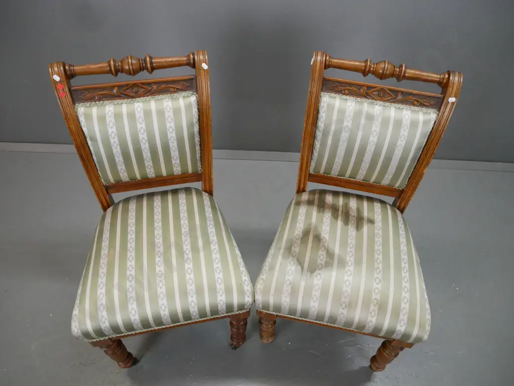 pair of colonial rimu & kauri Cromwellian style chairs with turned top rail and front legs, brown porcelain casters - Image 1++