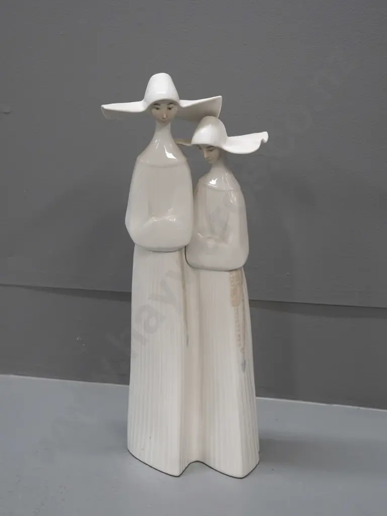 Lladro figure of 2 nuns, some adhesive residue on base H-330 Image 1++
