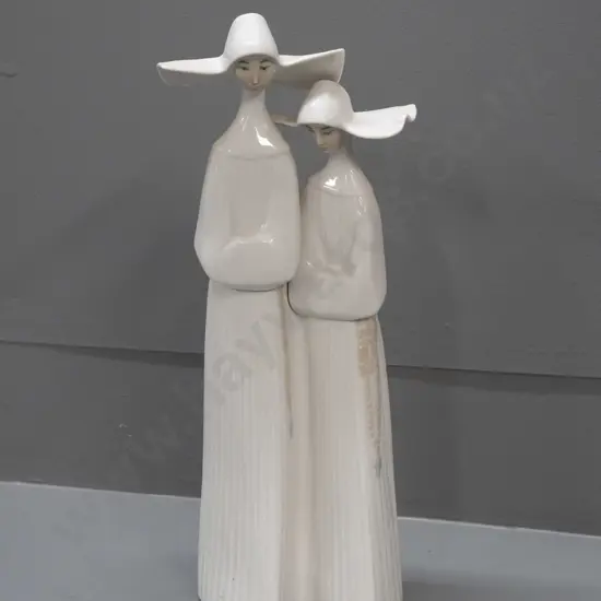 Lladro figure of 2 nuns, some adhesive residue on base H-330