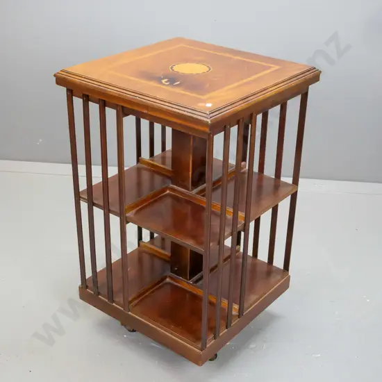 reproduction Sheraton revival style revolving bookcase with mahogany veneer, boxwood & ebony inlay in top - some damage