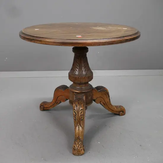 Victorian circular side table in mixed timbers with mahogany top, turned & carved column base on 3 sweeping carved feet.