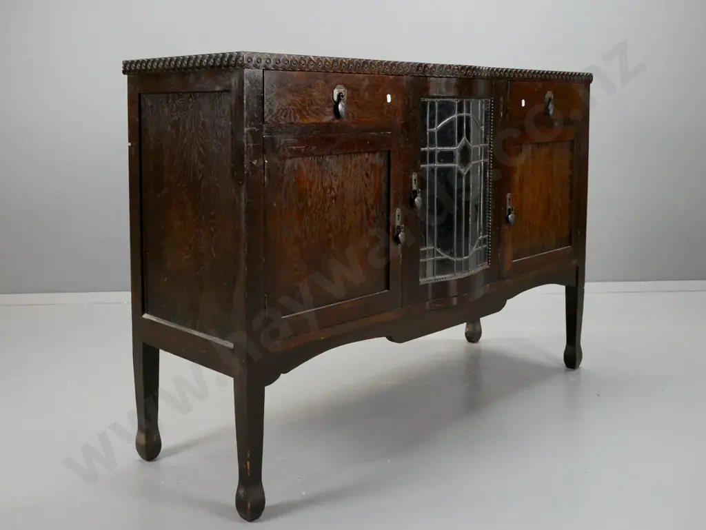 vintage art deco oak sideboard with moulded coin decorated edge, central leadlight door with working locks and key, Image 1++