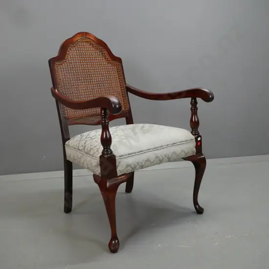 retro mahogany open-armed chair with cane insert in shaped back, turned front supports, light green upholstered seat - a