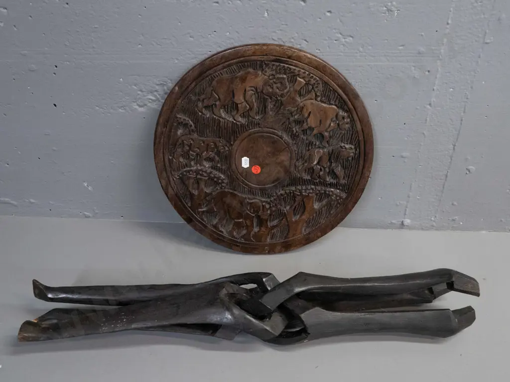 collapsible African carved hardwood table with tripod base, elephants and other animals in top, some cracks and drilled Image 1++
