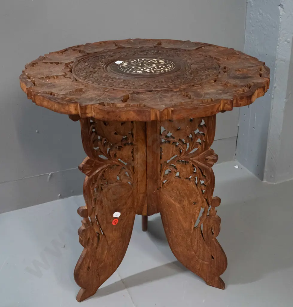 Indonesian carved hardwood collapsible table with hinged 3-piece base and lift-off top with bone inlay - some staining Image 1++