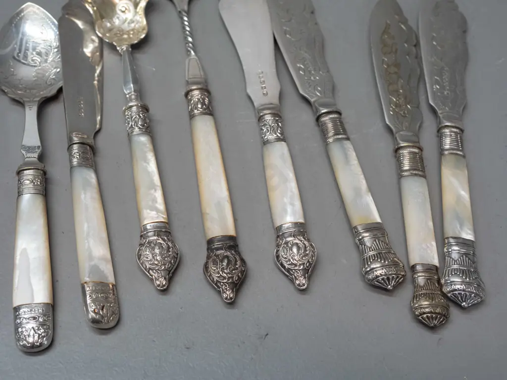 assorted vintage silver plated mother of pearl and bone handled cutlery, some with engraved blades, various patterns Image 1++