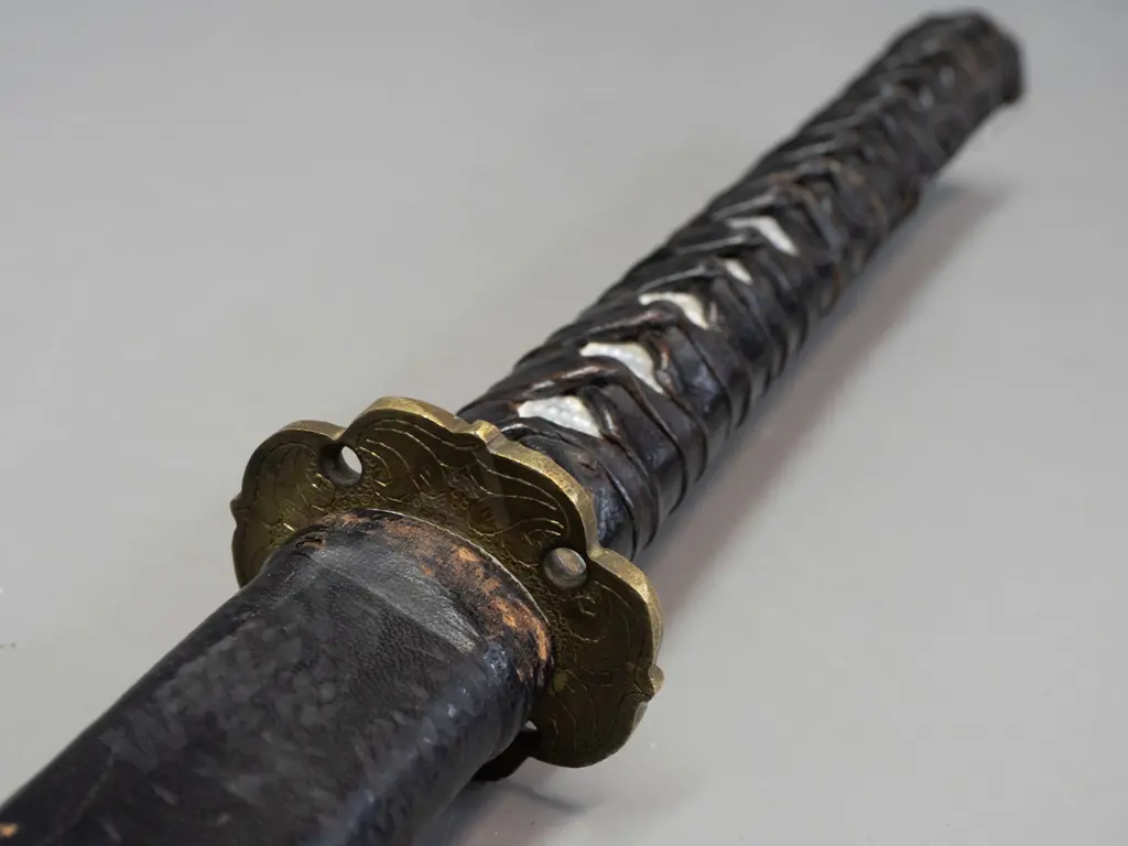 vintage Japanese sword in shark or ray skin covered scabbard, with small knife inset in handle, engraved brass handle Image 1++