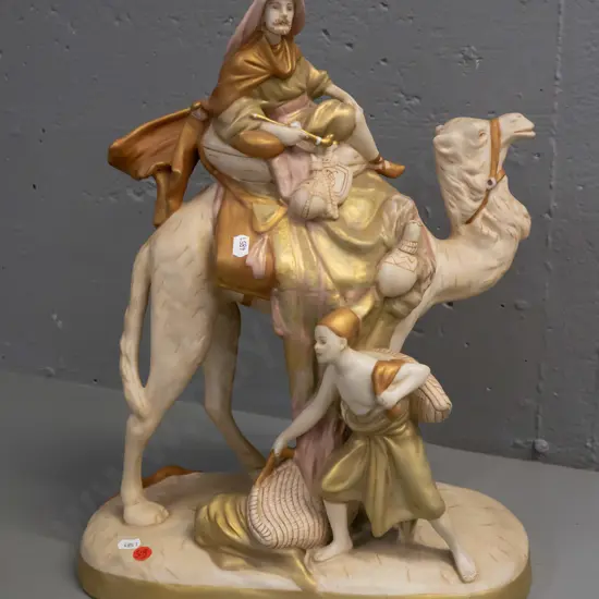 large Royal Dux Bohemian figure of a Bedouin, camel and attendant - minor scratching H-470 W-350