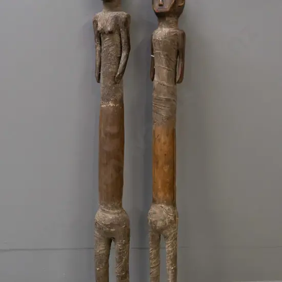 African pair of male and female carved wooden figures with fabric wrapping - Nyamwezi tribe, Tanzania - male figure has