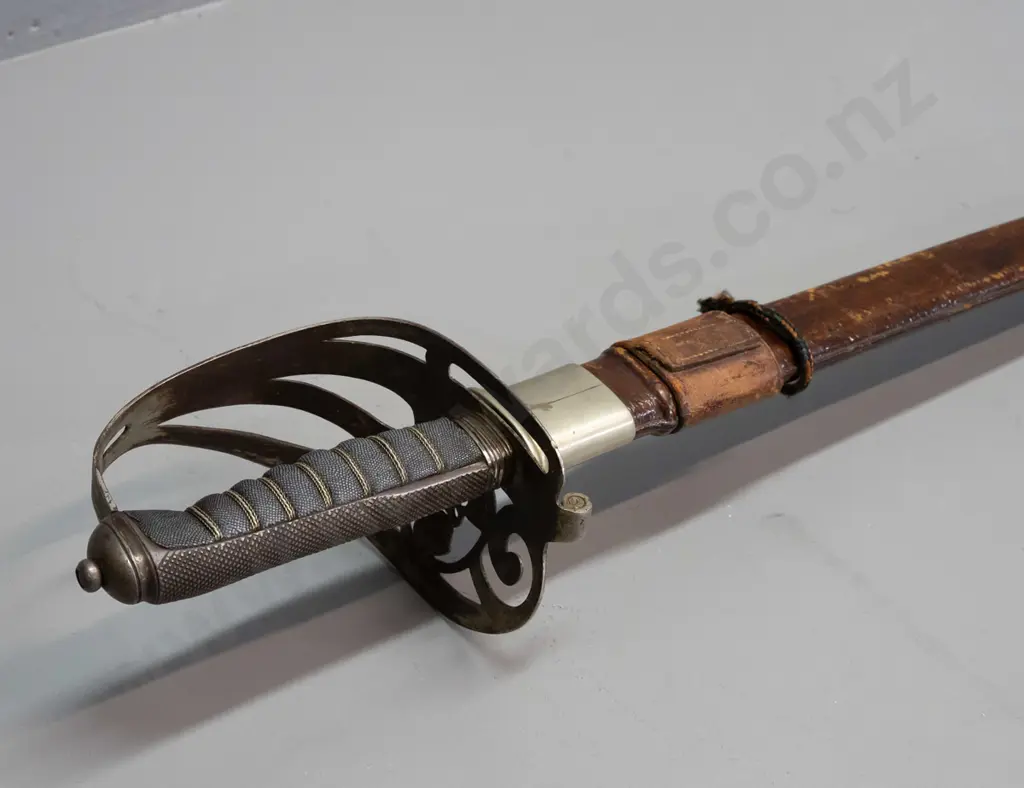 Manton of Calcutta officer's dress sword with etched decoration to blade, pierced hilt with crown, horn and ribbon Image 1++