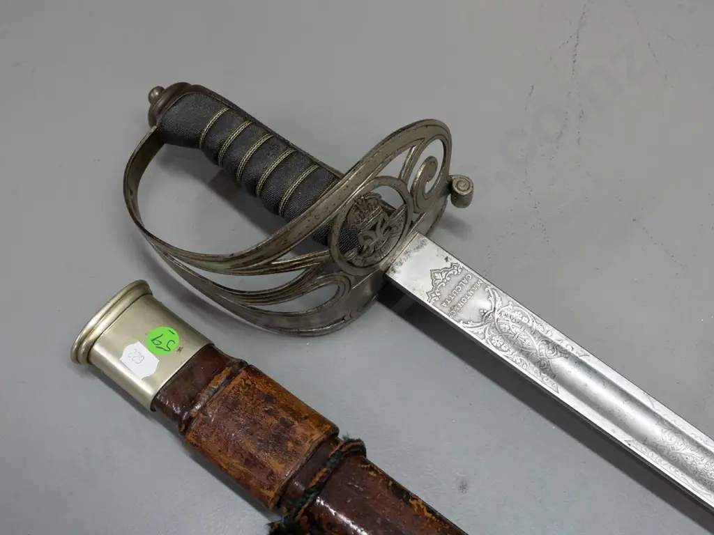 Manton of Calcutta officer's dress sword with etched decoration to blade, pierced hilt with crown, horn and ribbon Image 1++