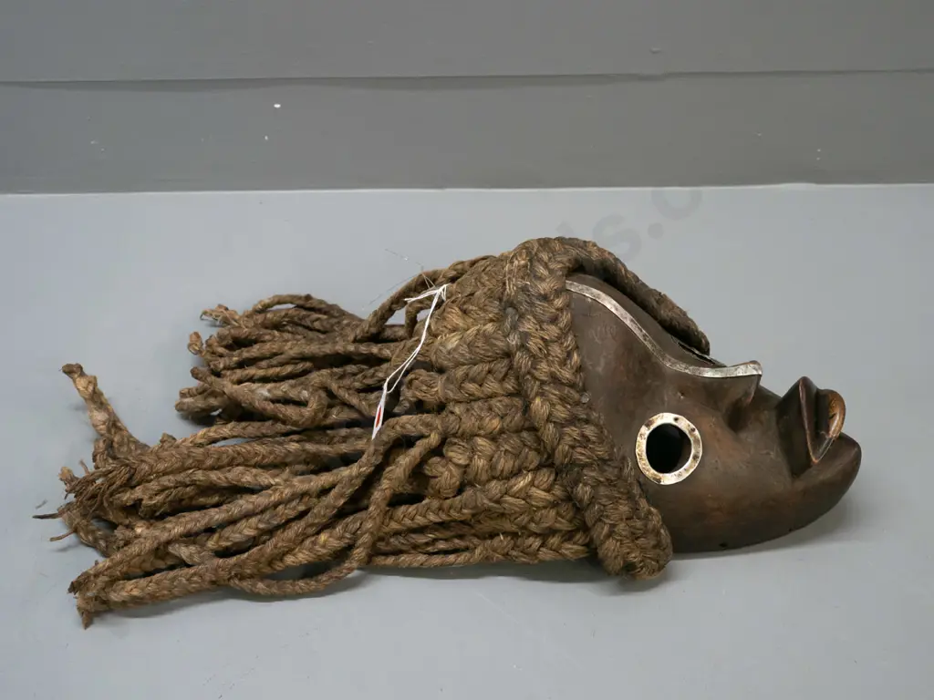 African carved wood Dan mask with metal eye surrounds, plaited fibre hair- Ivory Coast. Wooden part H-250 W-200 Image 1++