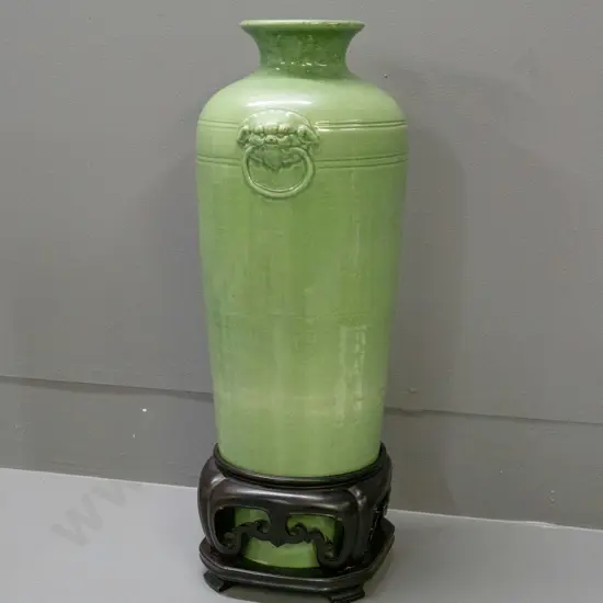 large Chinese green-glazed vase w/ moulded Foo Dog handles, & carved wooden stand H-480 [repair to rim, hairline cracks