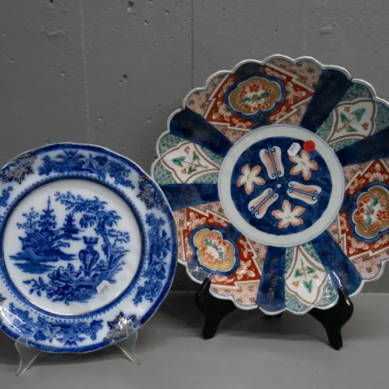 2 display plates - Japanese Imari charger w/ wall hanger D-310 and blue and white gilt rim, marked England / Lahore