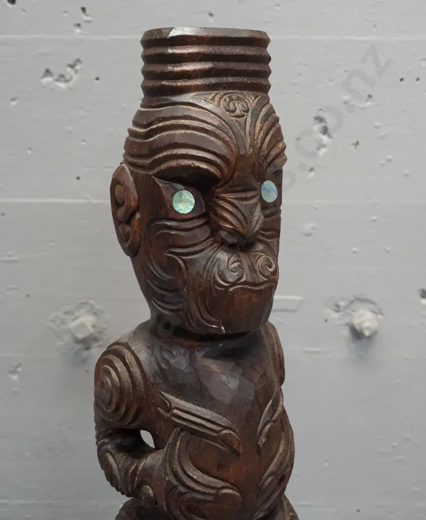 carved timber Maori standing figure with inset paua eyes - crack in base and a small carved timber decorative oar. Image 1++
