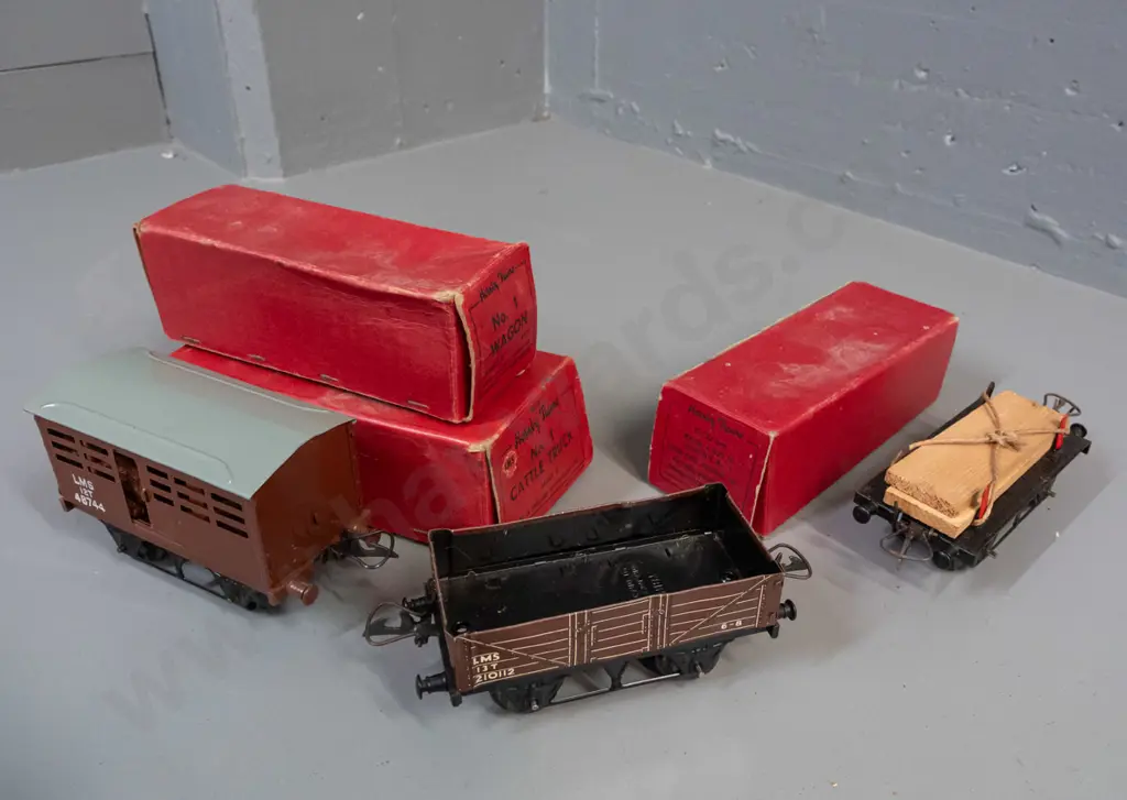 3 boxed Hornby 'O' gauge model railway items in original boxes - timber wagon, cattle truck and LMS wagon - some light Image 1++