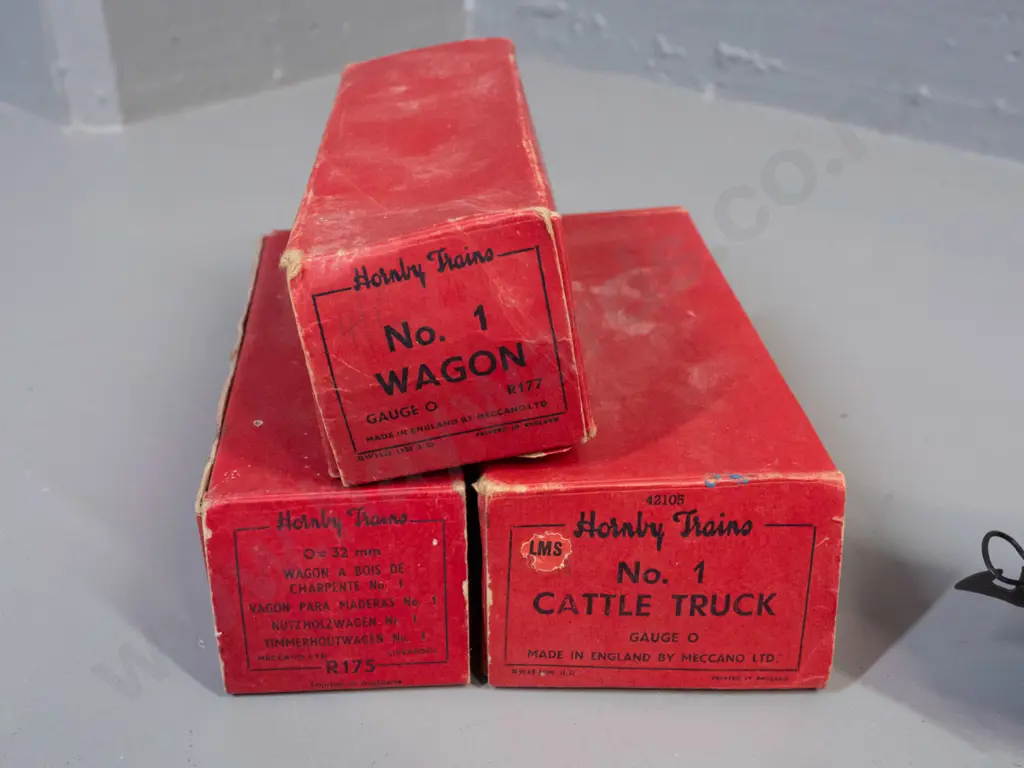 3 boxed Hornby 'O' gauge model railway items in original boxes - timber wagon, cattle truck and LMS wagon - some light Image 1++