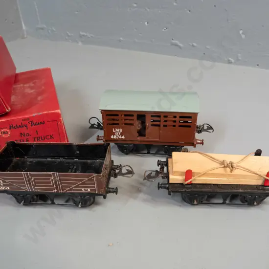 3 boxed Hornby 'O' gauge model railway items in original boxes - timber wagon, cattle truck and LMS wagon - some light