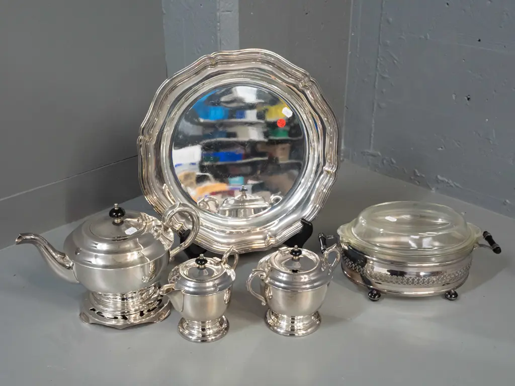 silver plated table ware - teapot on stand, cream & sugar and pyrex dish in plated holder, all with black bakelite or Image 1++
