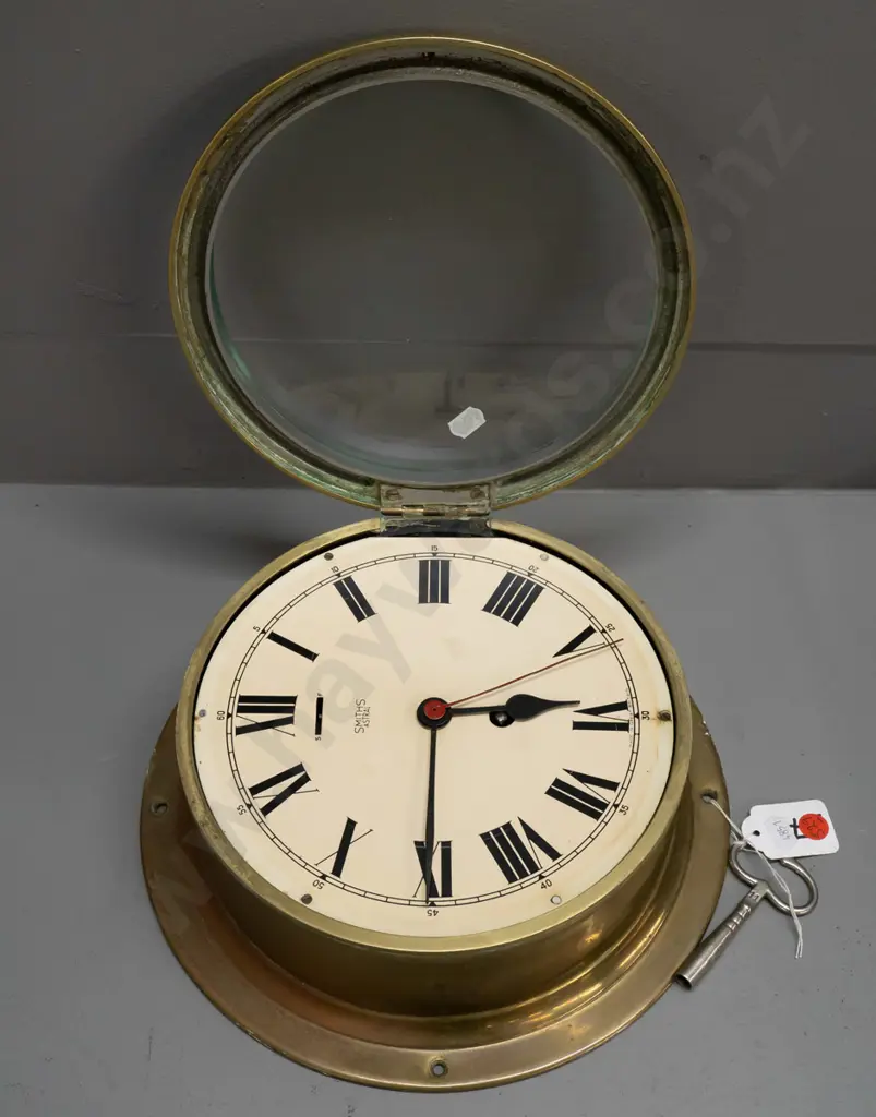 Smiths Astral brass-cased ship's clock with key, bevelled edge glass - some discolouration to brass D-260 Image 1++