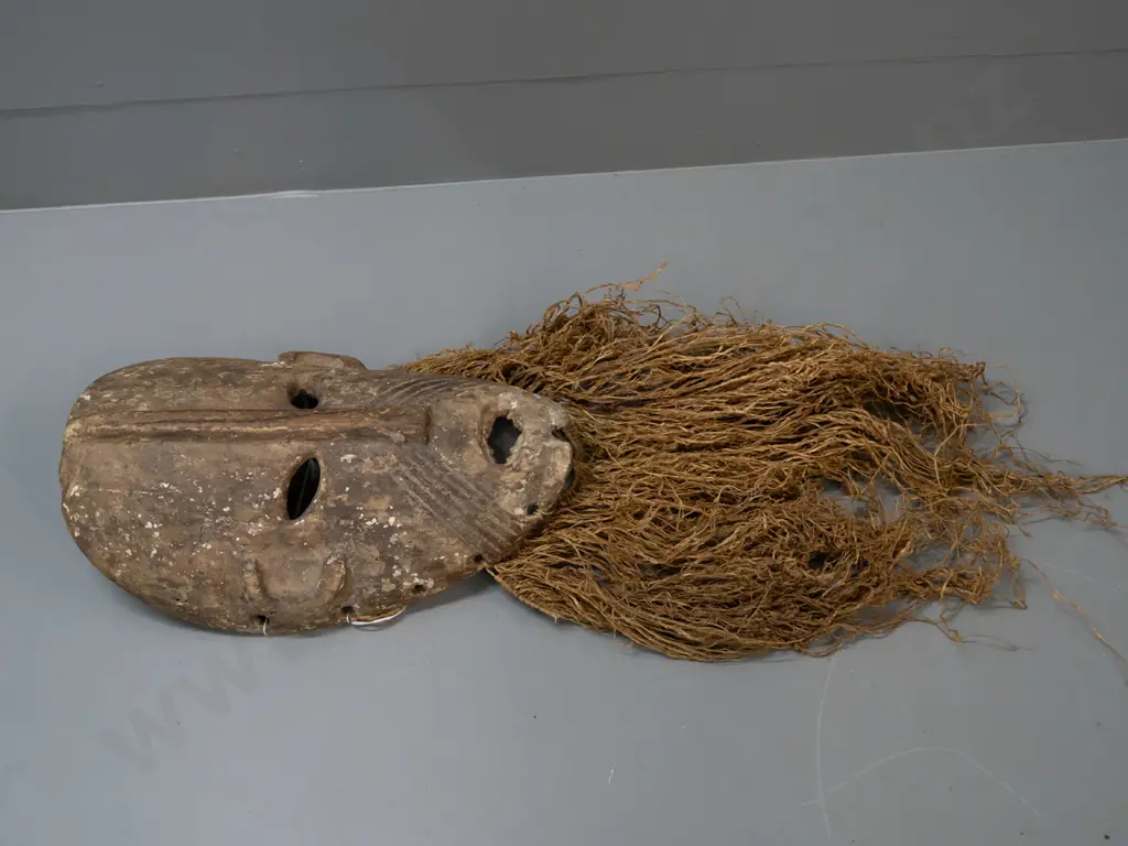 wooden mask with textile or grass fringe, remnants of pigment, Lega tribe, DRC (Congo) - split in nose, some wear to Image 1++
