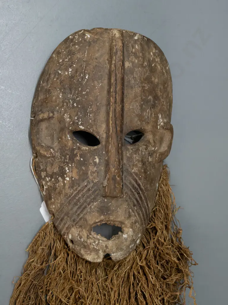 wooden mask with textile or grass fringe, remnants of pigment, Lega tribe, DRC (Congo) - split in nose, some wear to Image 1++
