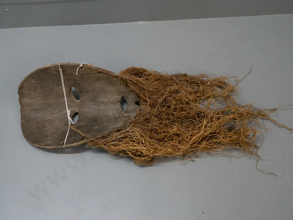 wooden mask with textile or grass fringe, remnants of pigment, Lega tribe, DRC (Congo) - split in nose, some wear to Image 1++
