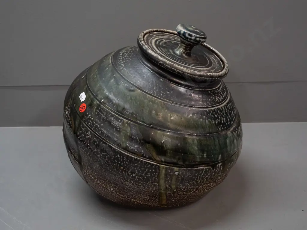 John Madden New Zealand studio pottery large salt glazed lidded pot with angled base - glaze loss or firing flaw on side Image 1++