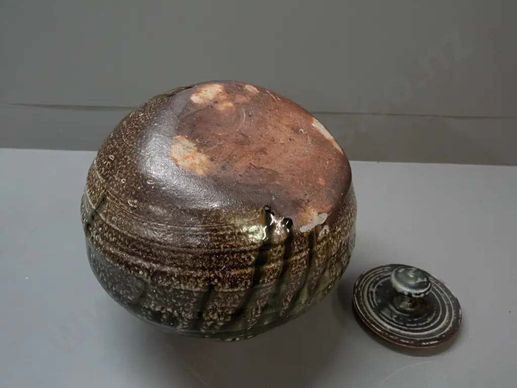John Madden New Zealand studio pottery large salt glazed lidded pot with angled base - glaze loss or firing flaw on side Image 1++