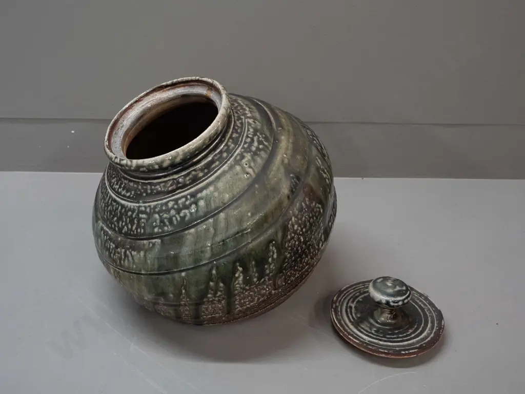 John Madden New Zealand studio pottery large salt glazed lidded pot with angled base - glaze loss or firing flaw on side Image 1++