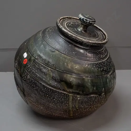 John Madden New Zealand studio pottery large salt glazed lidded pot with angled base - glaze loss or firing flaw on side