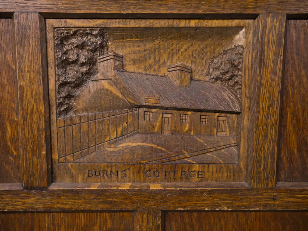 vintage oak fire screen with twist supports and top rail, panelled insert w/ carved panel depicting Burns' cottage, Image 1++
