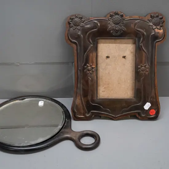 art nouveau style copper and wood picture frame with card back hinge and a hardwood hand mirror with hallmarked silver