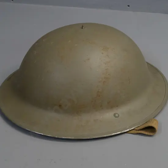 WWII-era British army helmet with suspension liner, webbing strap, missing top dome - overall age wear