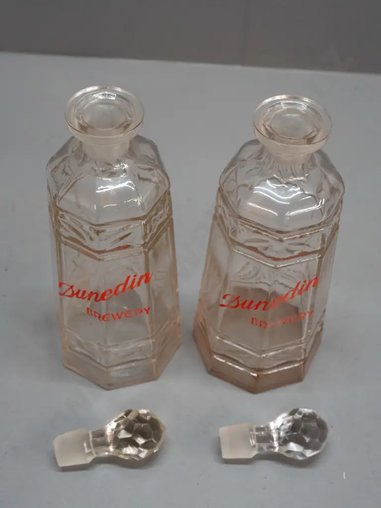 pair of clear glass stoppered decanters marked "Dunedin Brewery" - one with staining inside, minor wear to lettering on Image 1++