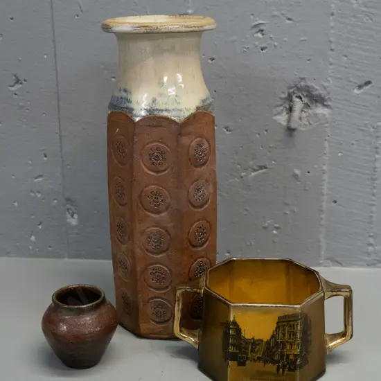 tall studio pottery vase with impressed decoration, small squat pottery vase and an Excella English Dunedin