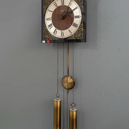 retro Schatz German arch-top wall clock with applied cast decoration, Tempus Fugit logo, brass weights and pendulum.