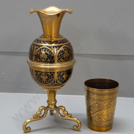 2 brass items - vase on 3 scrolling legs with black enamel work and a tumbler with incised bird motifs - vase has had
