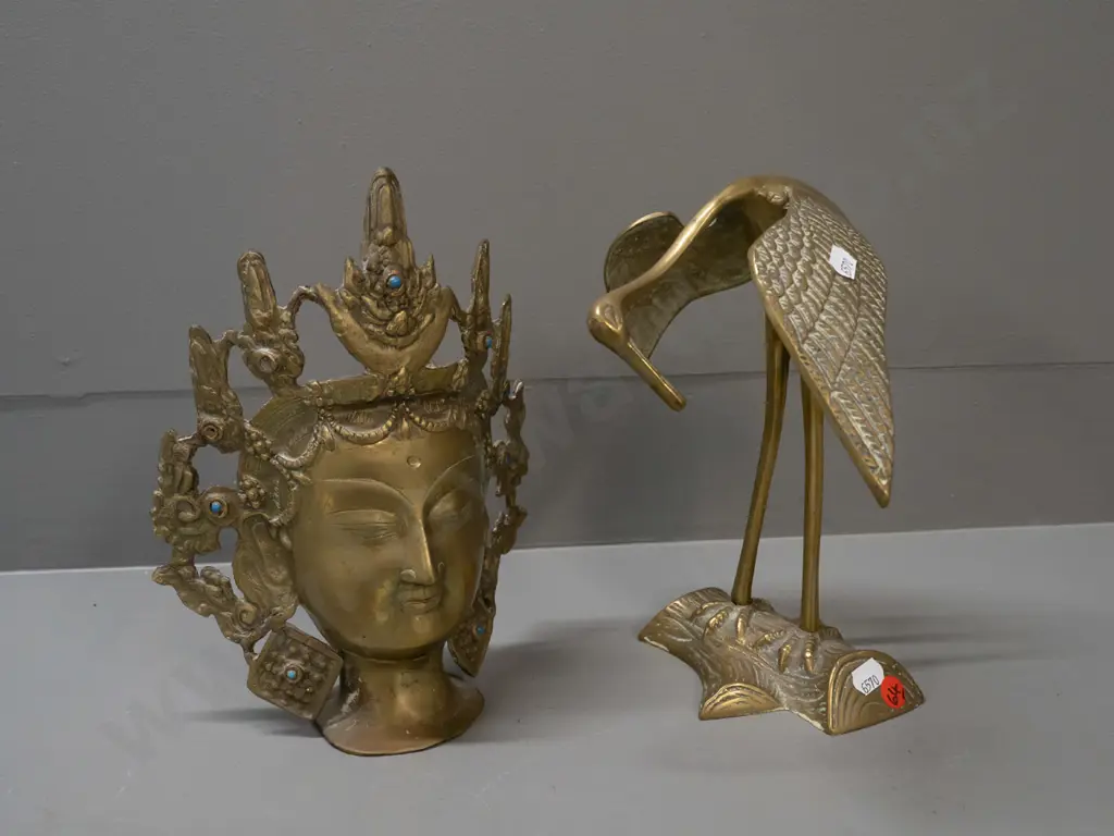 2 cast brass pieces - crane and a Thai-style head, missing a few blue stone or glass inserts, both approx. H-240 Image 1++