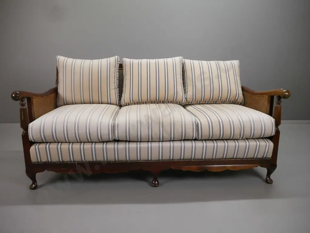 mid-century mahogany cab-leg bergere cane settee with shaped crest to back, fluted arm supports, striped fabric squabs - Image 1++