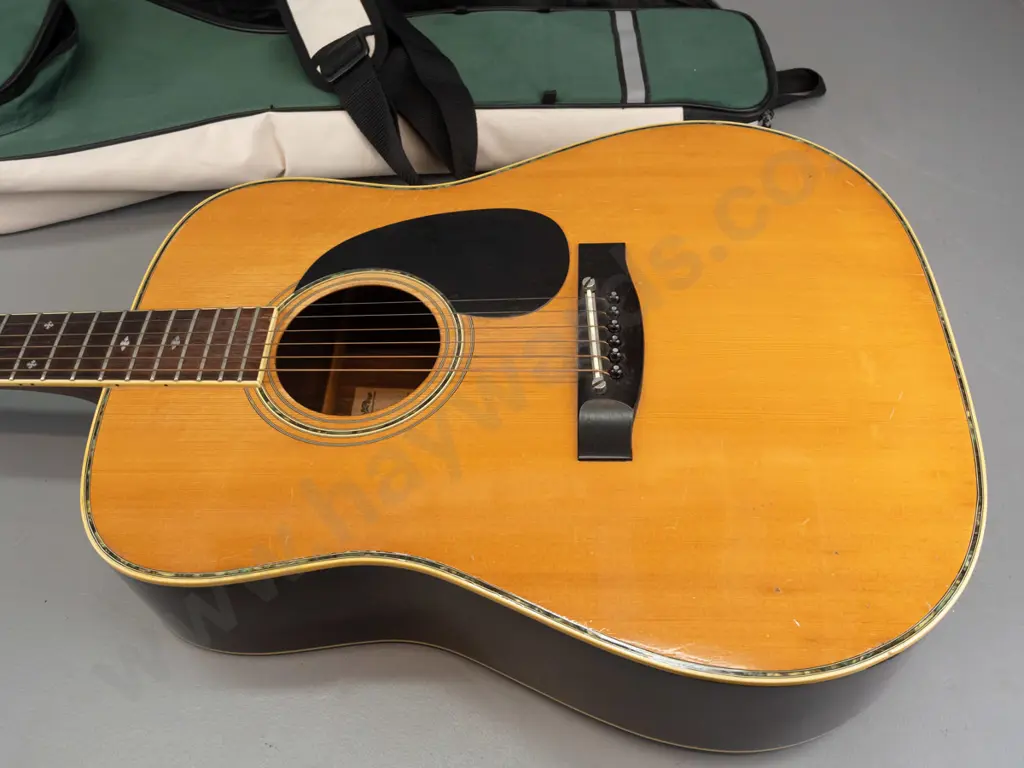 Fender F-65 dreadnought acoustic guitar, circa 1970s, with Dixon padded gig bag and some spare strings. Has some dents Image 1++